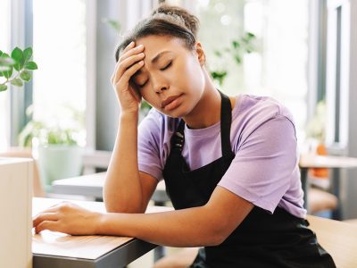 compressed_tired-african-american-waitress-suffering-headache-2026-03-19-07-46-09-utc